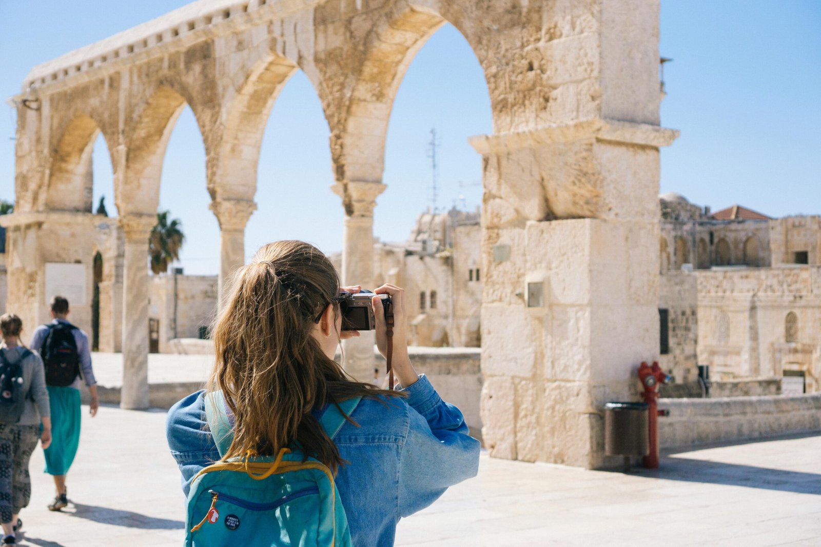 Picture of woman taking pictures of ruins in Jerusalem, Israel
