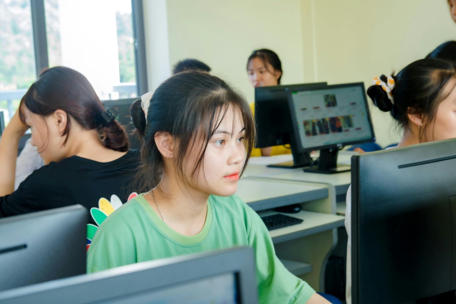 A woman working on Computer in a computer lab