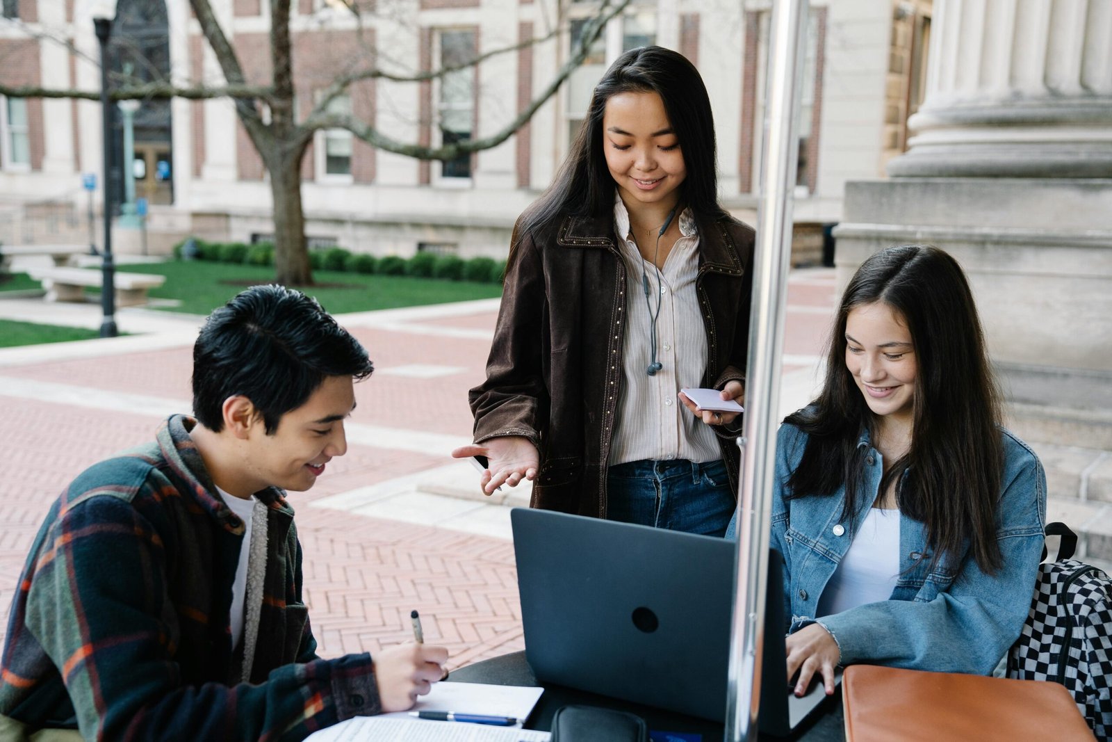 Group of friends working on a laptop