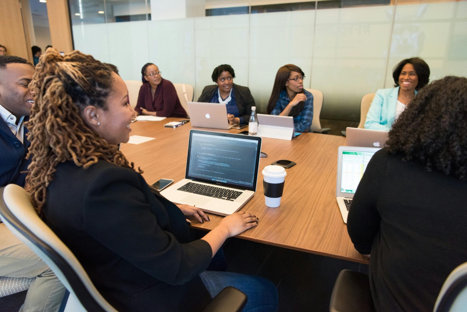 Group of People in a meeting and each Using Laptop Computer