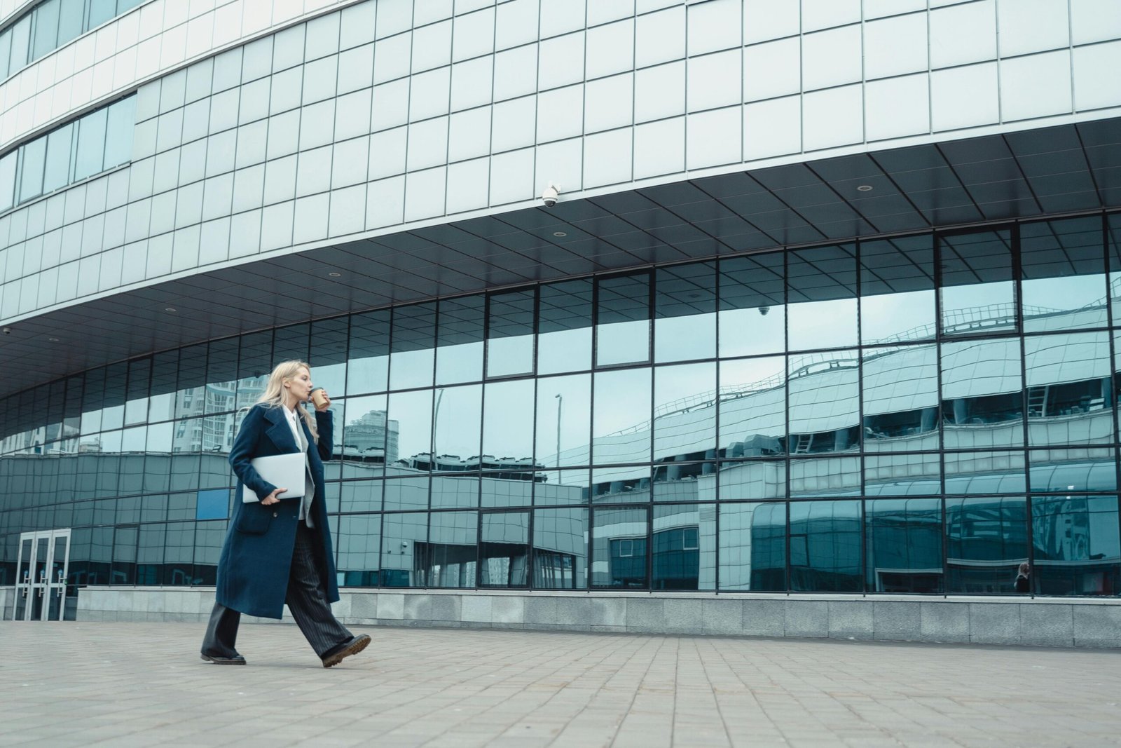 A cooperatively dressed woman walking on the street