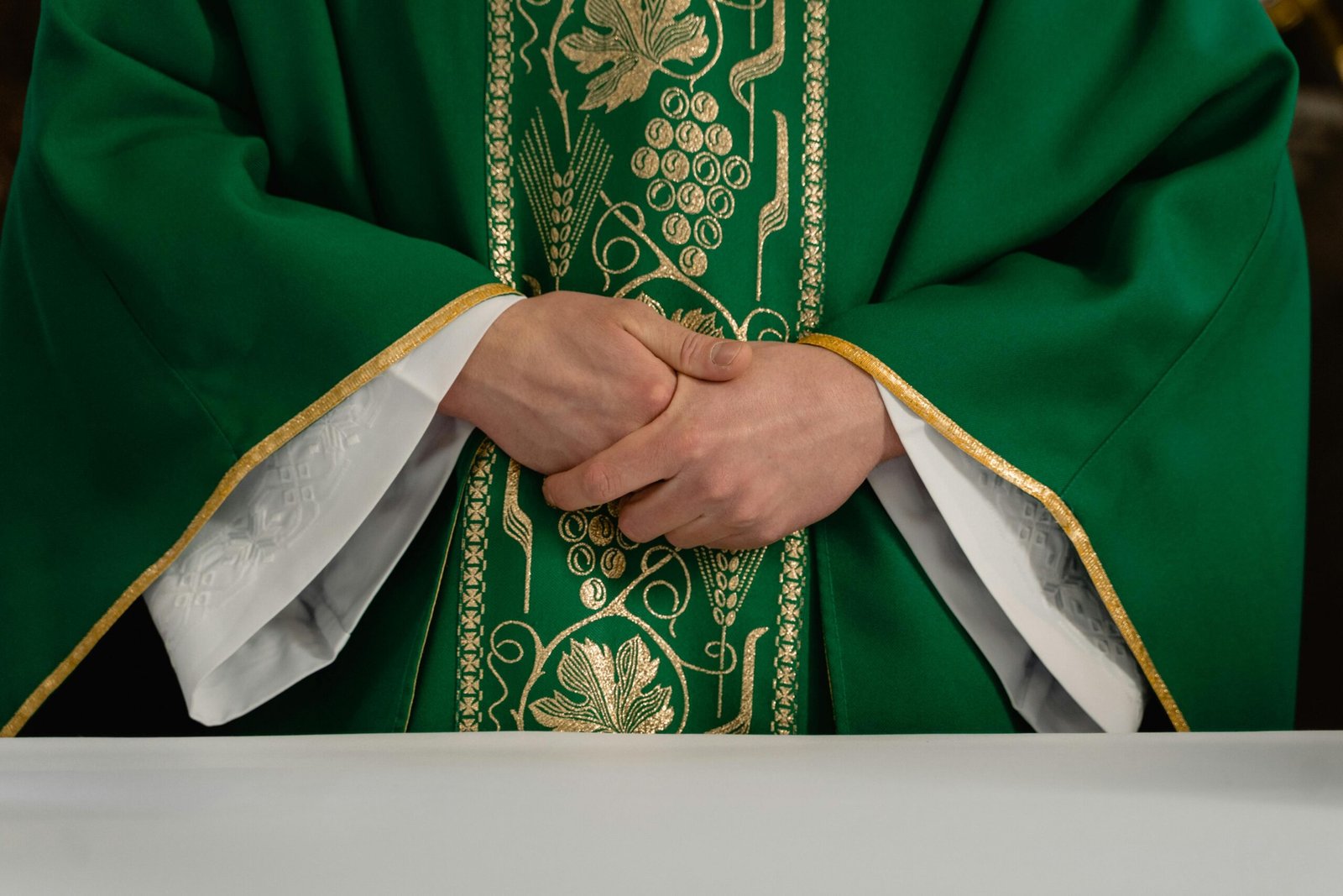 A priest Wearing Green Chasuble