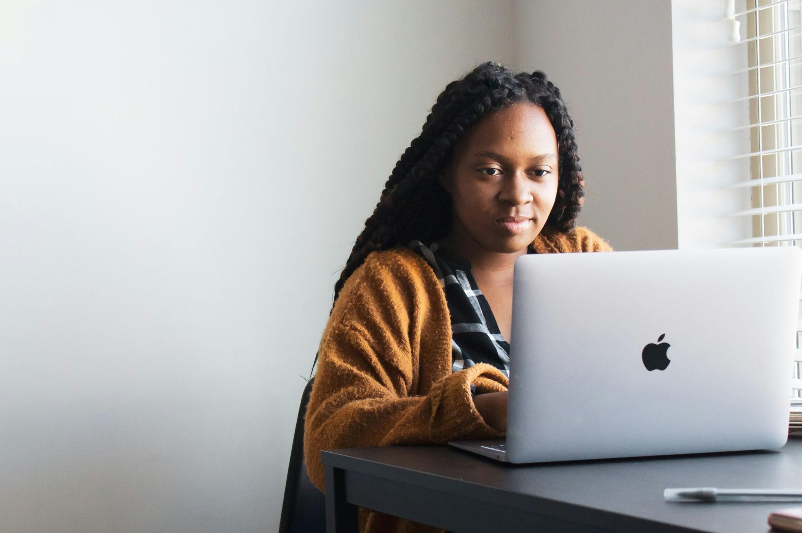 A Nigeria lady using her laptop in the early hours of the day